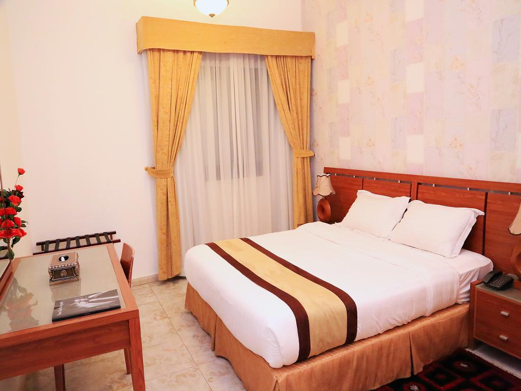 Arcadia Hotel Suites Sharjah Habitación foto
